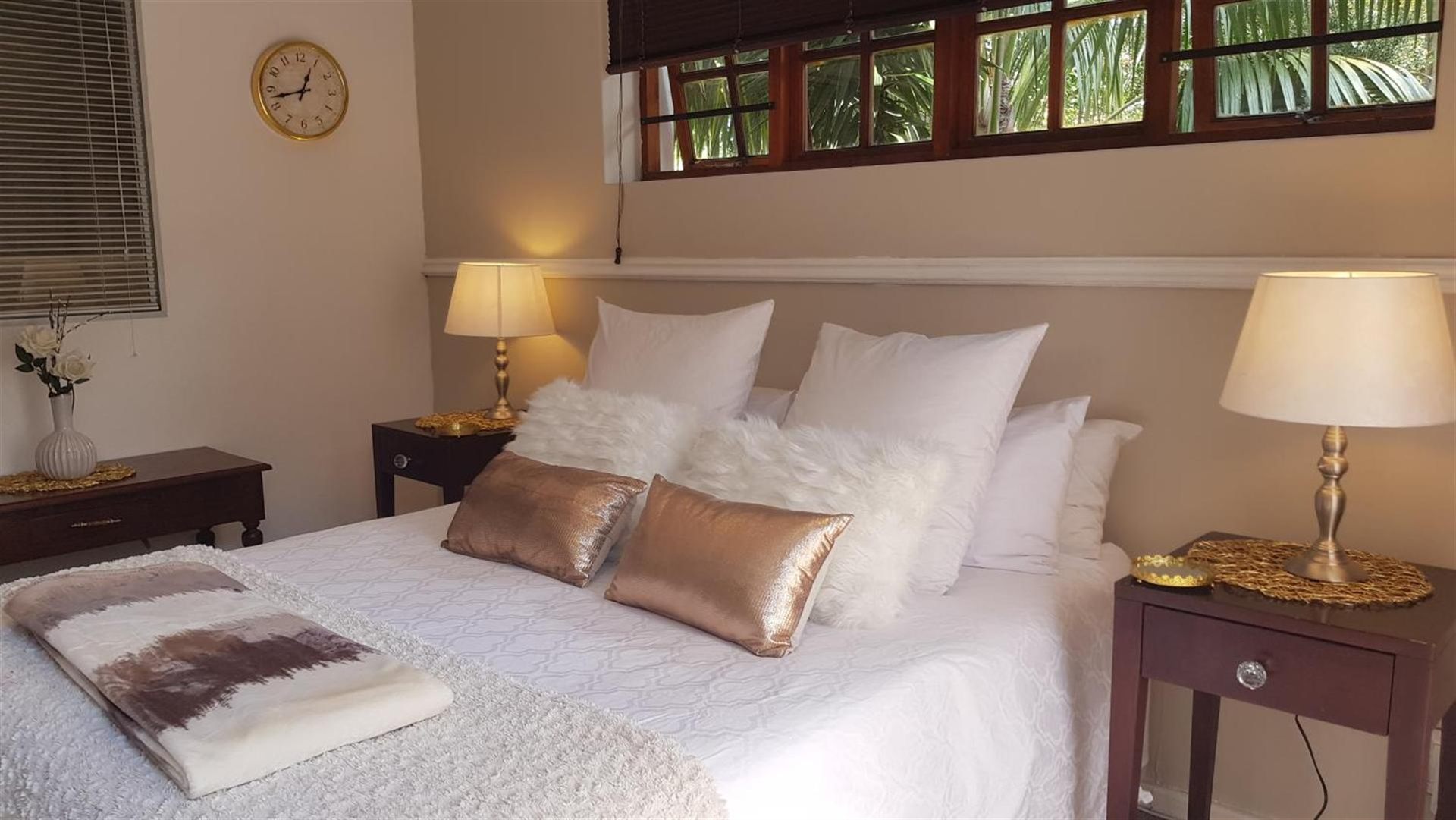 A warm, comfortably furnished bedroom at Walmer Heights Guesthouse